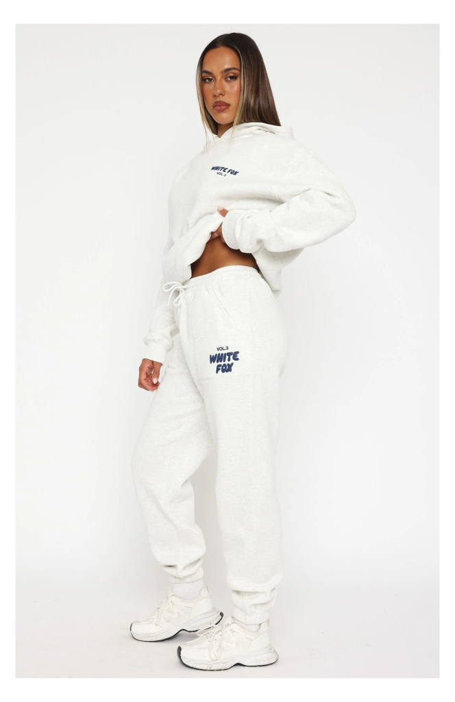 White Fox Sweatpants in soft fabric, styled casually with a hoodie, perfect for lounging or streetwear across the UK.